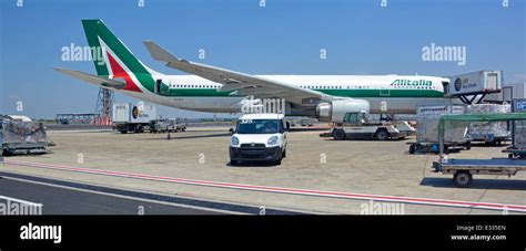 Alitalia Airbus A330 200 Parked On Concrete Airport Apron Stand At