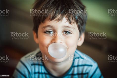 Cute Boy Blowing Bubble Gum Stock Photo Download Image Now Balloon
