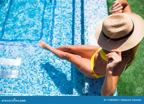 Woman Relaxing On The Swimming Pool Water In Hot Sunny Day Summer