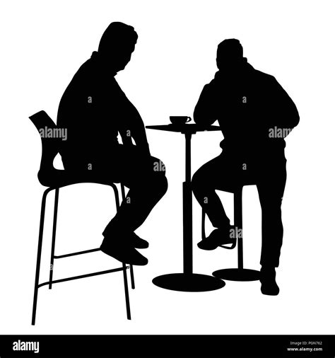 Two mans silhouette sitting at a table in the cafe, bar, restaurant or ...