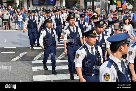 Tokyo Metropolitan Police Officers Stand Guard Around The Ryogoku