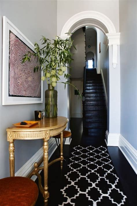 Vintage acrylic paintings, a dark colored staircase, and a twiggy chandelier can make. 5 Ways To Decorate A Narrow Hallway - shoproomideas