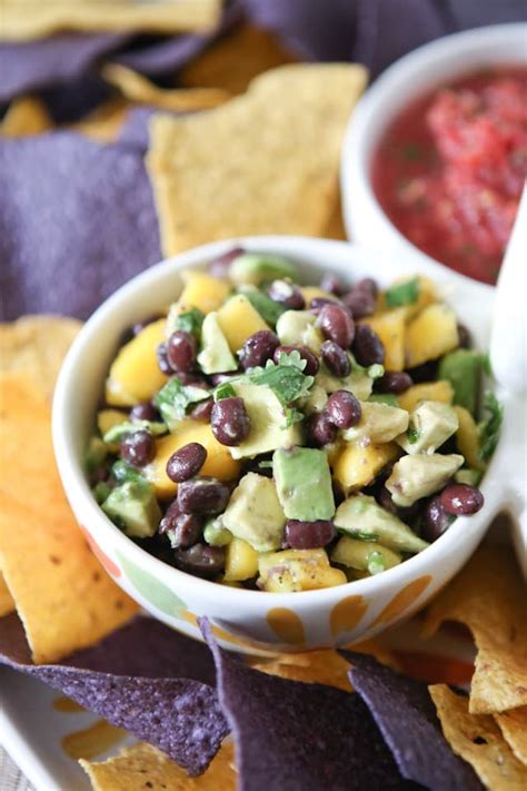 Place all ingredients escept the mango, avocado and lime juice in a food processor and pulse until very finely. Mango Avocado and Black Bean Salsa Recipe