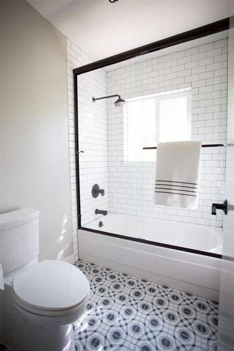 Black And White Bathroom With Patterned Floor Tile And Subway Tile