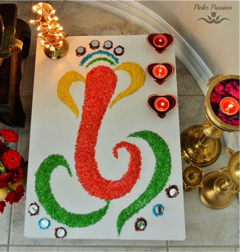 This Is An Image Of A Diwali With Candles And Flowers On The Floor