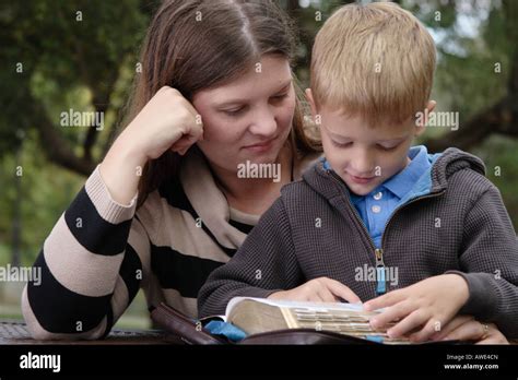 Stock Photograph Of A Young Boy And His Mother Reading Stock Photo Alamy