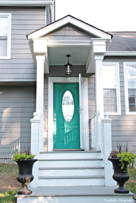 A dark green front door goes well with a variety of home styles, and can coordinate with stone, brick, gray, black, white, brown or tan homes. Pop of Color on the Front Door! - Southern Hospitality