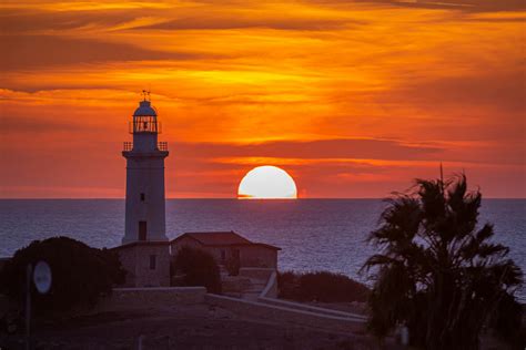 White Concrete Lighthouse During Sunset · Free Stock Photo
