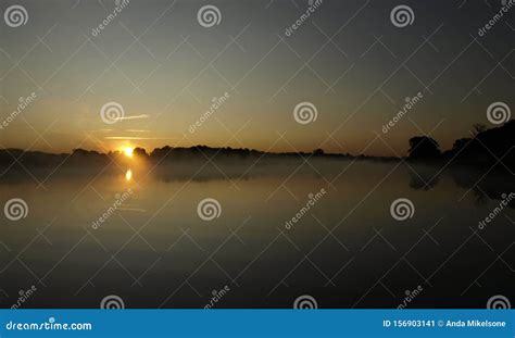 Sunrise Above A River On Foggy Summer Morning The Sky Reflections In