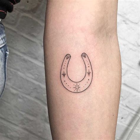 Minimal Horseshoe Tattoo Inked On The Left Forearm Horse Shoe Tattoo