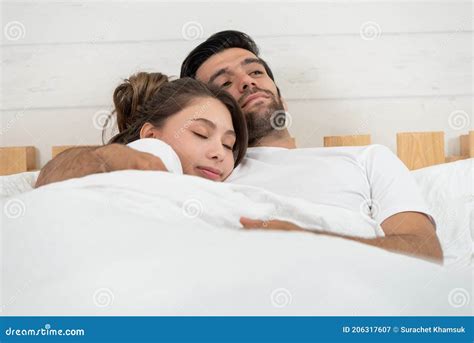 Loving Couple Relaxing And Hugging In Bed Love And Relationships