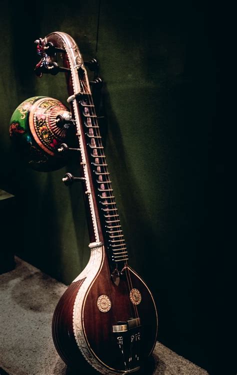 An Instrument Is On Display In A Room With Dark Green Walls And