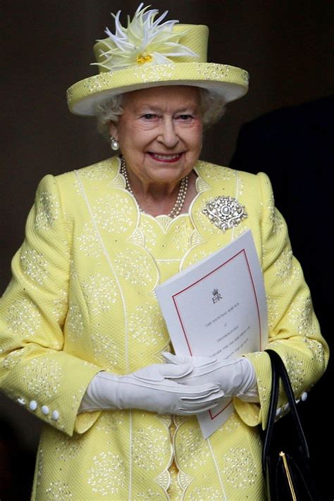 The Queen Of England Is Holding Her Award