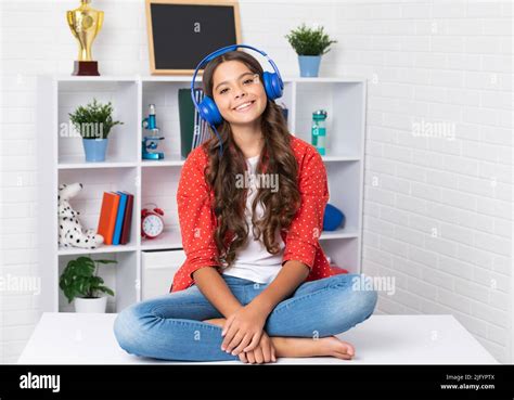 Teenager Schoolgirl Listening Music Portrait Of Teen With Headphone