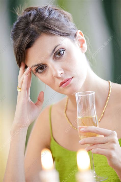Woman Drinking Champagne Stock Image C Science Photo Library