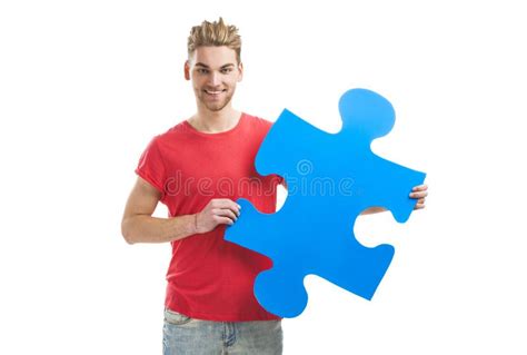 Young Man Holding A Puzzle Piece Stock Photo Image Of Concept