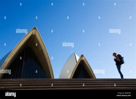 A Backpacker On The Steps Of The Opera House In Sydney New South Wales