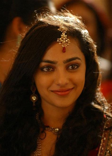 nithya menen gorgeous photos in red saree