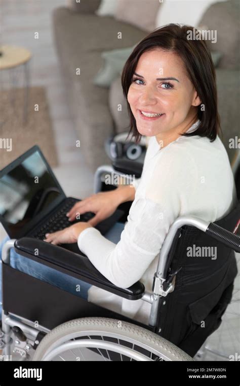 Smiling Young Beautiful Disabled Woman In A Wheelchair Stock Photo Alamy