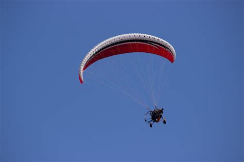 Person Paragliding During Daytime · Free Stock Photo