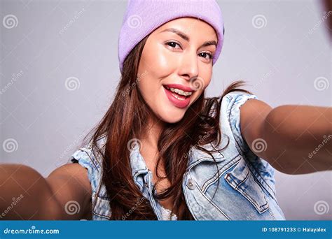 Model In Casual Summer Jeans Clothes With No Makeup In Purple Beanie