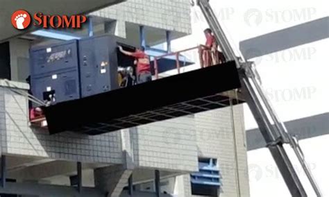 The high side of the wall is no longer a workplace, so osha is not an issue at this time. Workers repair machinery on elevated platform at AMK ...
