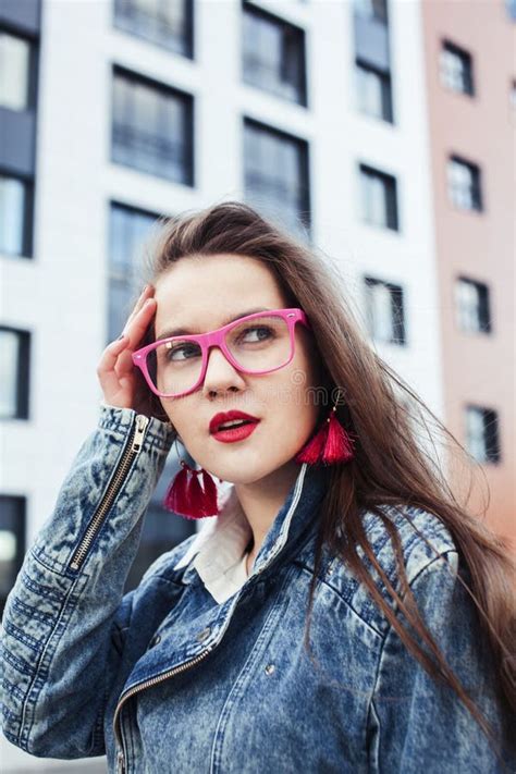 Young Pretty Brunette Business Woman Posing Emotional Against Modern