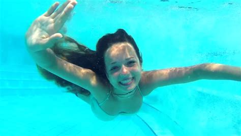 Beauty Young Woman Swimming Underwater In Swimming Pool