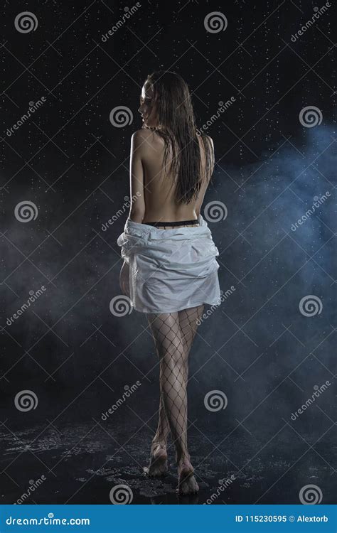 Beautiful Wet Slim Girl Wearing A White Wet Shirt And Large Stock Image