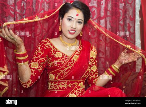 beautiful nepali bride with wedding dress and make up at the wedding ceremony in nepal stock