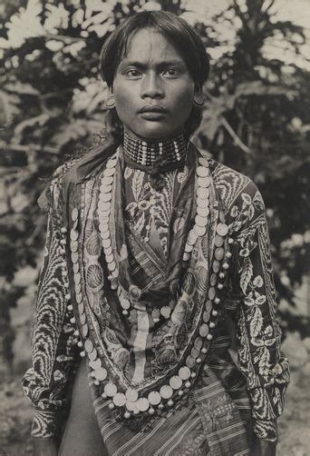 philippines a kalinga man adorned in elaborate fabric necklaces and ear disks luzon island