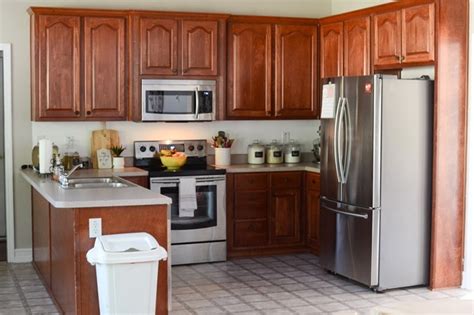 It wasn't bold and intentional. Painted kitchen cabinets makeover with Magnolia paint