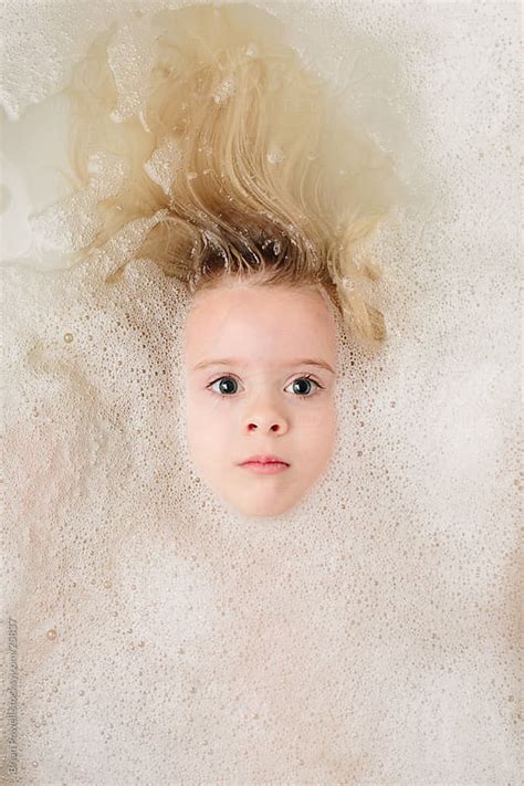 Girl Washing Her Hair In Bubble Bath By Brian Powell Stocksy United