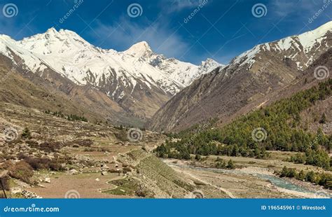 Landscape Of Snow Covered Himalayan Mountains Near The Village Of