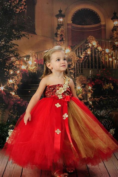 Lets kick off these red and gold spanish wedding ideas right and say, how gorgeous is this dress!!! Red+and+Gold+Christmas+Flower+Girl+One+by ...