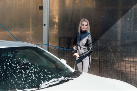 beautiful blonde woman washes her car at car wash stock image image of flirt caucasian 202081413