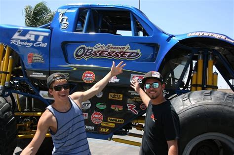 Team Rider Eric Swanson And Jason Posing Next To His Monster Truck