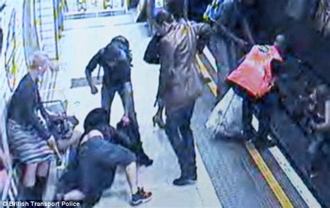 the moment crazed commuter shoves 23 year old woman on to tube tracks daily mail online