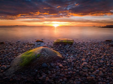 Sunset Coast Stone Beach Agdenes Municipality In Norway Summer