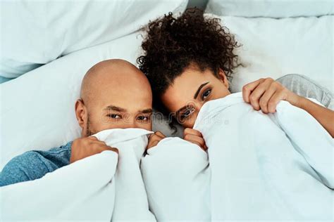 Sharing Special Moments Under The Covers An Affectionate Young Couple