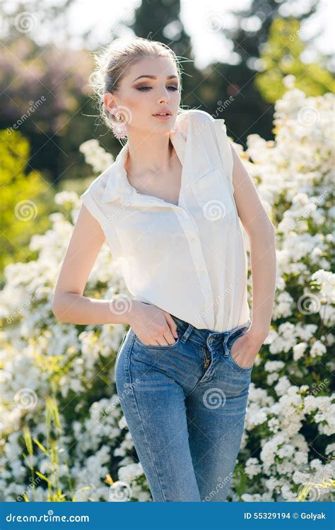 Beautiful Happy Woman In A Flowery Spring Garden Stock Photo Image