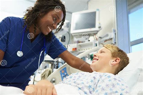 Boy Talking To Female Nurse In Emergency Room Stock Image Image Of