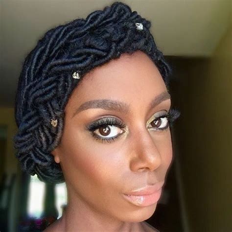 The other side has a stylish pattern while the braids have braid cuffs and beads. 50 Superb Black Wedding Hairstyles