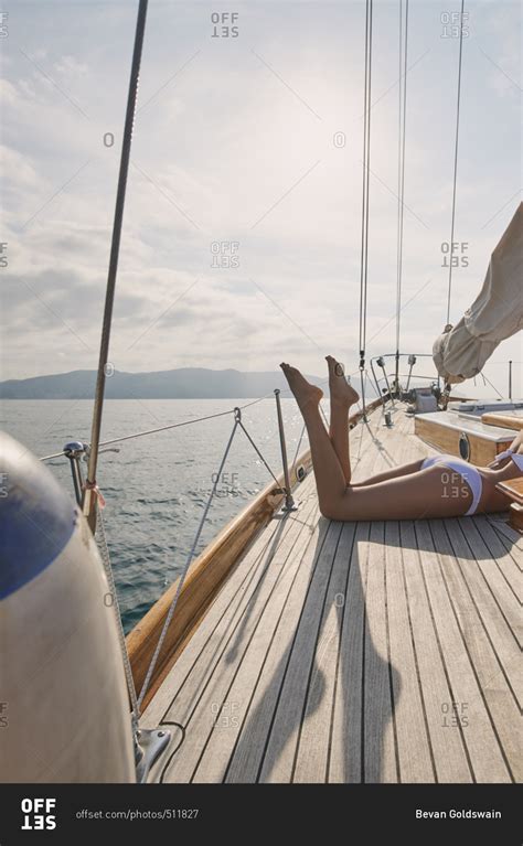 Beautiful Sexy Womans Legs On Luxury Sailboat Yacht In Ocean On Lifestyle Happy Adventure
