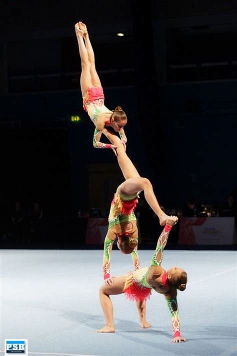 Two Women Doing Acrobatic Tricks On The Floor