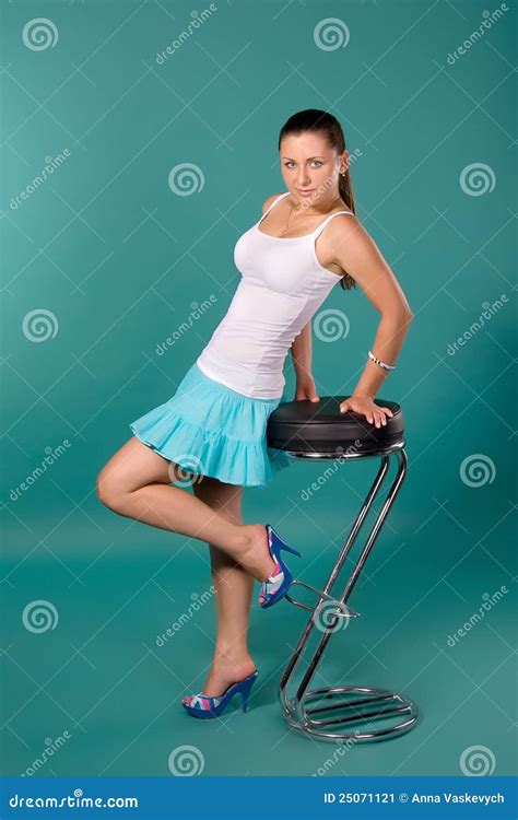 girl in a white shirt and blue skirt stock image image of cyan skirt 25071121