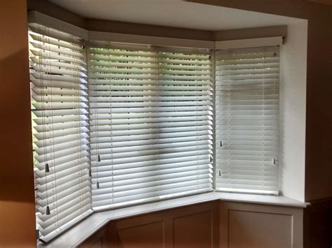 Wood venetian blinds for a bay window, supplied and installed by The