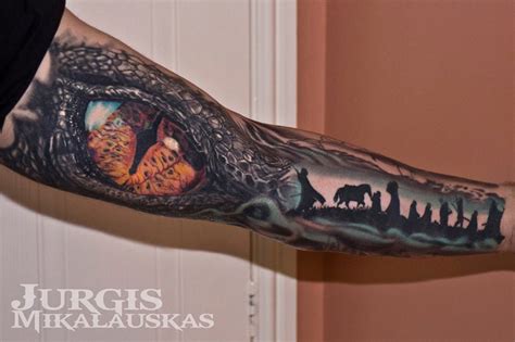 An artist can fit a snake through even the most awkward gap, or they can make the reptile twist and turn its way through any object. Realistic Reptile Eye on Guys Arm | Best tattoo design ideas