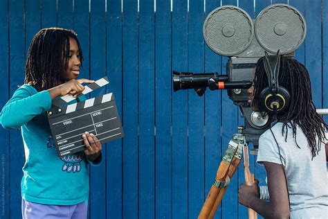 two black girls doing a movie with an old 16mm film camera by stocksy contributor gabriel