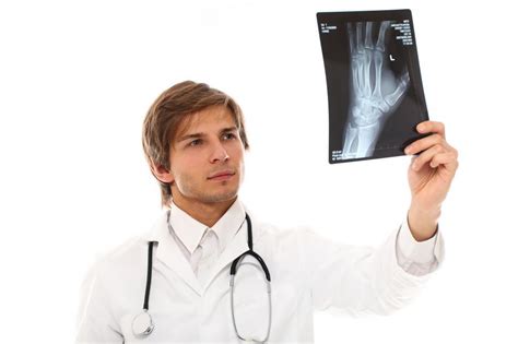Free Stock Photo Of Doctor Holding Up An X Ray Transparency Download